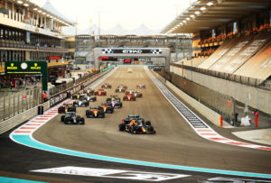 ABU DHABI, UNITED ARAB EMIRATES - DECEMBER 13: Max Verstappen of the Netherlands driving the (33) Aston Martin Red Bull Racing RB16 leads Lewis Hamilton of Great Britain driving the (44) Mercedes AMG Petronas F1 Team Mercedes W11 and Valtteri Bottas of Finland driving the (77) Mercedes AMG Petronas F1 Team Mercedes W11 into turn one at the start during the F1 Grand Prix of Abu Dhabi at Yas Marina Circuit on December 13, 2020 in Abu Dhabi, United Arab Emirates. (Photo by Bryn Lennon/Getty Images) // Getty Images / Red Bull Content Pool // SI202012130392 // Usage for editorial use only //