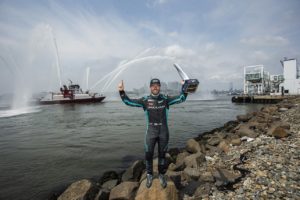 BROOKLYN STREET CIRCUIT, UNITED STATES OF AMERICA - JULY 11: Sam Bird (GBR), Jaguar Racing, 1st position, celebrates on the shores of the Husdson River with his trophy during the New York City E-Prix II at Brooklyn Street Circuit on Sunday July 11, 2021 in New York City, United States of America. (Photo by Andrew Ferraro / LAT Images)