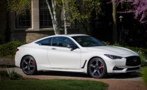 Q60 RED SPORT 400 AWD shown in Majestic White featuring 20-inch accessory alloy wheels