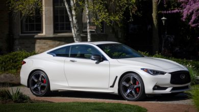 Q60 RED SPORT 400 AWD shown in Majestic White featuring 20-inch accessory alloy wheels
