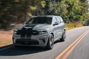 2022 Dodge Durango SRT 392: Equipped with the 392-cubic-inch HEMI V-8 delivering 475 horsepower and 470 lb.-ft. of torque, the Durango SRT 392 features aggressive exterior styling and a driver-centric cockpit, shown here in Destroyer Grey with Dual Low Gloss Gunmetal stripes.