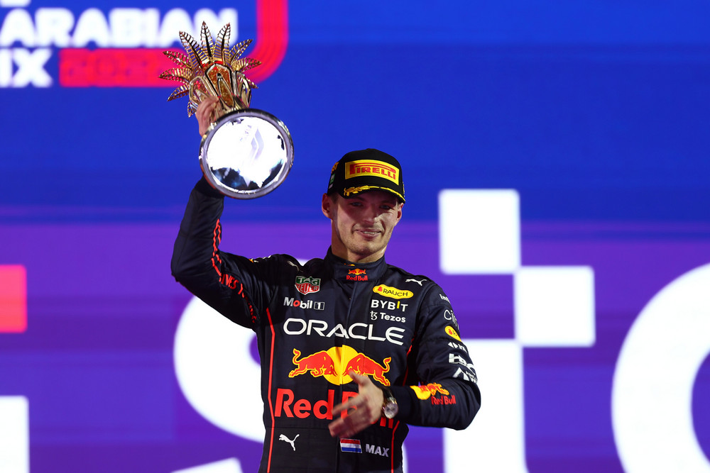 JEDDAH, SAUDI ARABIA - MARCH 27: Race winner Max Verstappen of the Netherlands and Oracle Red Bull Racing celebrates on the podium during the F1 Grand Prix of Saudi Arabia at the Jeddah Corniche Circuit on March 27, 2022 in Jeddah, Saudi Arabia. (Photo by Lars Baron/Getty Images) // Getty Images / Red Bull Content Pool // SI202203270587 // Usage for editorial use only //