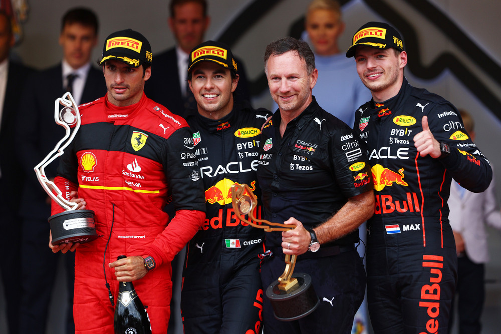 MONTE-CARLO, MONACO - MAY 29: Race winner Sergio Perez of Mexico and Oracle Red Bull Racing, Second placed Carlos Sainz of Spain and Ferrari, Third placed Max Verstappen of the Netherlands and Oracle Red Bull Racing and Red Bull Racing Team Principal Christian Horner celebrate on the podium during the F1 Grand Prix of Monaco at Circuit de Monaco on May 29, 2022 in Monte-Carlo, Monaco. (Photo by Clive Rose/Getty Images) // Getty Images / Red Bull Content Pool // SI202205290587 // Usage for editorial use only //