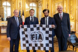 FIA President Ben Sulayem presented President Macron with with an FIA flag he had signed