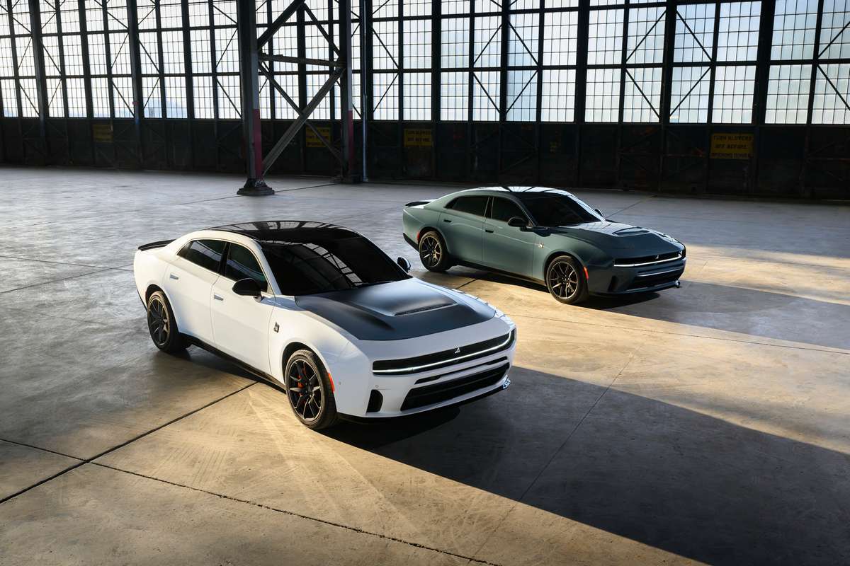 Gas-powered, 550-horsepower 2027 Dodge Charger Scat Pack models, shown in White Knuckle and Sub-Zero exterior colors. New custom options for the 2027 Dodge Charger include a Satin Black painted hood and orange Brembo brake calipers (both shown on White Knuckle Charger).