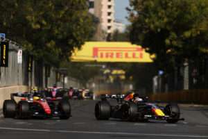 BAKU, AZERBAIJAN - SEPTEMBER 26:  Max Verstappen of the Netherlands driving the (3) Oracle Red Bull Racing RB22 Red Bull Ford Powertrains leads Lewis Hamilton of Great Britain driving the (44) Scuderia Ferrari SF-26 on track during the F1 Grand Prix of Azerbaijan at Baku City Circuit on September 26, 2026 in Baku, Azerbaijan. (Photo by Alex Pantling/LAT Images) // Getty Images / Red Bull Content Pool // SI202609260185 // Usage for editorial use only //