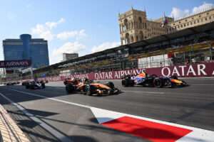 BAKU, AZERBAIJAN - SEPTEMBER 26: Isack Hadjar of France driving the (6) Oracle Red Bull Racing RB22 Red Bull Ford Powertrains and Lando Norris of Great Britain driving the (1) McLaren MCL40 Mercedes battle for track position during the F1 Grand Prix of Azerbaijan at Baku City Circuit on September 26, 2026 in Baku, Azerbaijan. (Photo by Michael Potts/LAT Images) // Getty Images / Red Bull Content Pool // SI202609260188 // Usage for editorial use only //